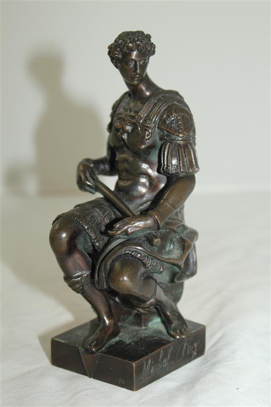 After the antique. A bronze model of a seated Roman soldier, inscribed Michel angelo, 6.5in, on separate marble plinth